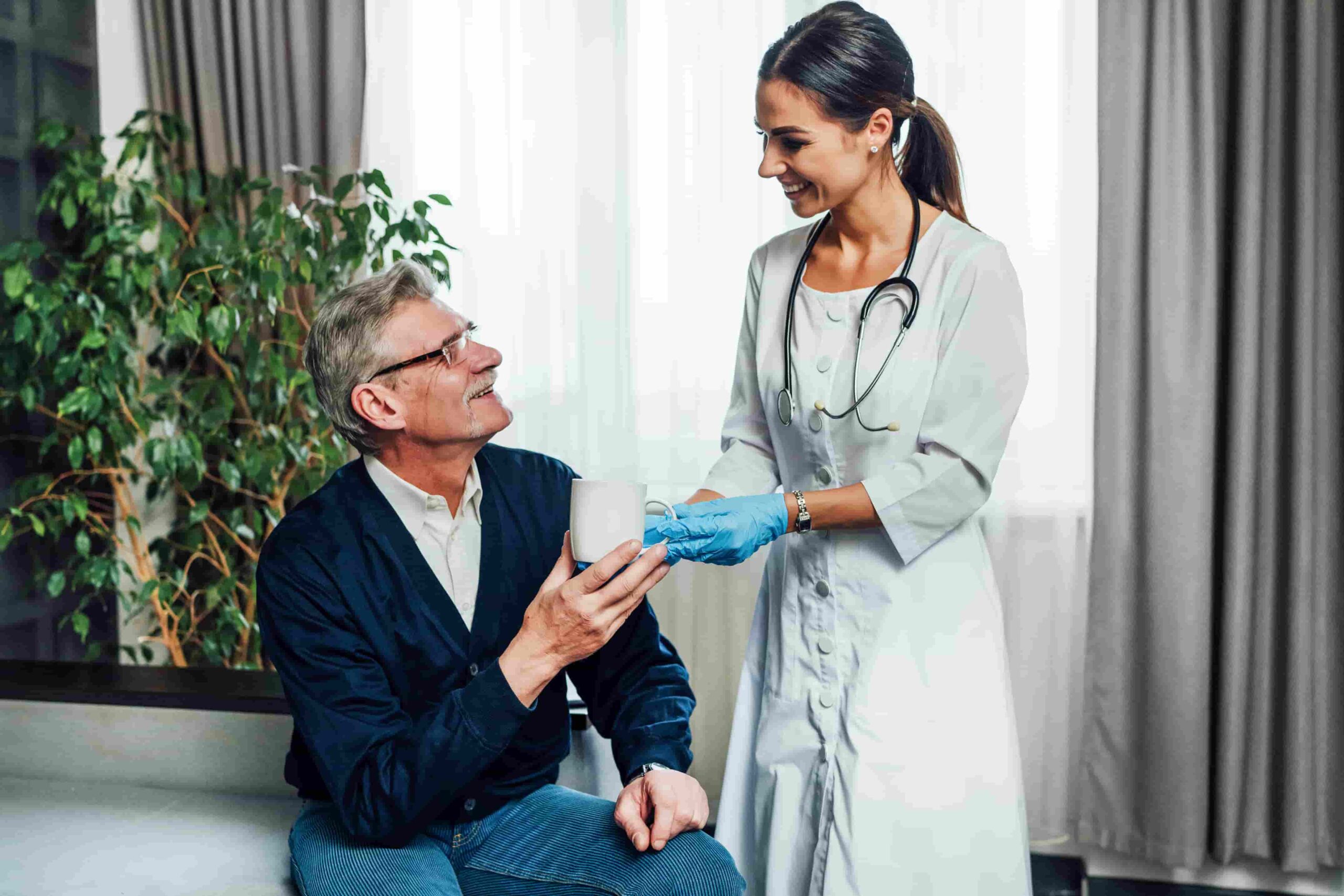 Photo Happy Female Doctor Giving Water Her Patient Nursing Home Assistant Help